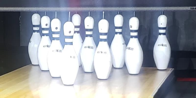 Latest string pinsetters eliminate anomalies, provide pinfall much closer to traditional pinsetters